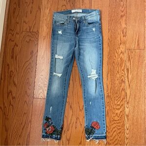 Flying Monkey distressed, ripped skinny jeans with flower appliqué. Size 25.
